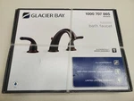 Glacier Bay Builders 8" 2-HANDLE Bathroom Faucet In Bronze 67364W-6A27D. Fixed Price $63.33.