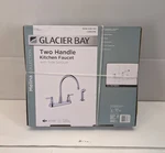 Glacier Bay Melina Two Handle Kitchen Faucet With Side Sprayer Polished Chrome. Fixed Price $62.50.