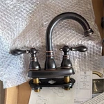 Kingston Brass Oil-rubbed Bronze Centerset High Arc Bathroom Faucet Drain. Fixed Price $75.00.