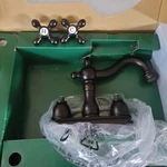Kingston Brass Deck Mounted Centerset Washerless Bronze Faucet KN1605AX. Fixed Price $69.00.