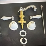 Newport Brass Widespread Bathroom/ Lavatory Faucet Porcelain Handles 860/26. Fixed Price $199.00.