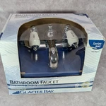 Glacier Bay Chrome Bathroom Faucet Two Handle Pop Up Drain Series 300 102-856L. Fixed Price $29.99.