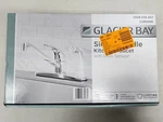 Single-handle Standard Kitchen Faucet Polished Chrome With White Deck Sprayer. Fixed Price $34.97.