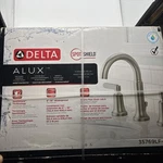 Delta Alux Two-handle Widespread Bathroom Faucet Model: 35769LF-SP. Fixed Price $79.99.
