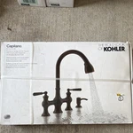 Kohler Capilano Oil-rubbed Bronze Pull-down Kitchen Faucet W/ Soap Dispenser. Fixed Price $125.00.