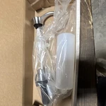 Delta RP60781AR Wall Mounted Soap Dispenser, Modern Metal/plastic, Silver/white. Fixed Price $36.62.
