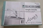 Single-handle Standard Kitchen Faucet Polished Chrome With White Deck Sprayer. Fixed Price $35.05.