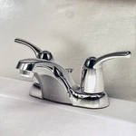 Moen CA84403 Bathroom Faucet Chrome Finish Control 2-HANDLE Low Arc Nib. Fixed Price $59.96.