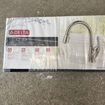 Delta Izak Single Handle Pull-down Kitchen Faucet Brilliance Stainless W/soap. Fixed Price $150.00.