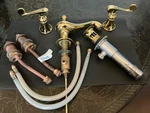 Kohler Revival K-16102-4-PB Bathroom Sink Faucet Polished Brass Scroll Handle. Fixed Price $450.00.